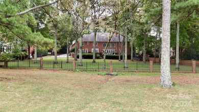 This exquisite brick residence located in Providence Country on Providence Country Club in North Carolina - for sale on GolfHomes.com, golf home, golf lot