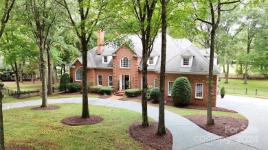 This exquisite brick residence located in Providence Country on Providence Country Club in North Carolina - for sale on GolfHomes.com, golf home, golf lot