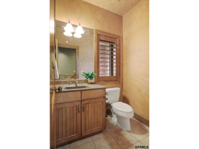 This gorgeous, custom-built home sits on a nearly 1-acre lot on Indian Creek Golf Club in Nebraska - for sale on GolfHomes.com, golf home, golf lot