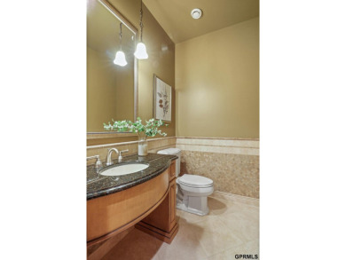 This gorgeous, custom-built home sits on a nearly 1-acre lot on Indian Creek Golf Club in Nebraska - for sale on GolfHomes.com, golf home, golf lot