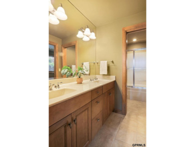 This gorgeous, custom-built home sits on a nearly 1-acre lot on Indian Creek Golf Club in Nebraska - for sale on GolfHomes.com, golf home, golf lot