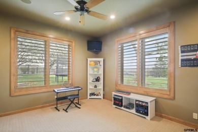 This gorgeous, custom-built home sits on a nearly 1-acre lot on Indian Creek Golf Club in Nebraska - for sale on GolfHomes.com, golf home, golf lot
