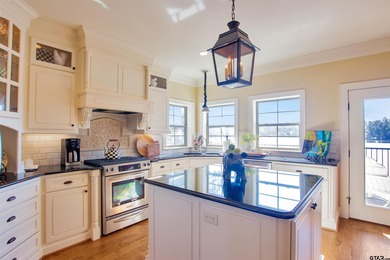 This stunning 4-bedroom, custom built 3408 sq ft lake front home on Hide-A-Way Lake Golf Course in Texas - for sale on GolfHomes.com, golf home, golf lot