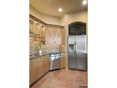 This gorgeous, custom-built home sits on a nearly 1-acre lot on Indian Creek Golf Club in Nebraska - for sale on GolfHomes.com, golf home, golf lot