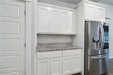 Step into comfort with this inviting 3-bedroom, 2-bath home on Bella Vista - Metfield Golf Complex and Country Club in Arkansas - for sale on GolfHomes.com, golf home, golf lot