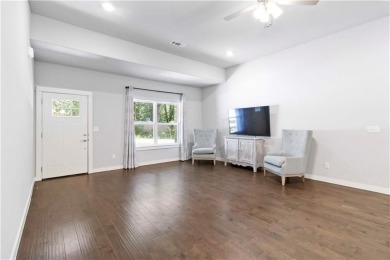 Step into comfort with this inviting 3-bedroom, 2-bath home on Bella Vista - Metfield Golf Complex and Country Club in Arkansas - for sale on GolfHomes.com, golf home, golf lot