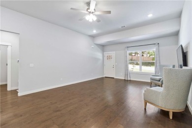 Step into comfort with this inviting 3-bedroom, 2-bath home on Bella Vista - Metfield Golf Complex and Country Club in Arkansas - for sale on GolfHomes.com, golf home, golf lot