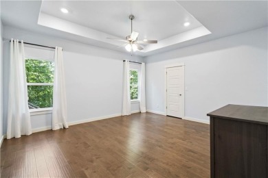 Step into comfort with this inviting 3-bedroom, 2-bath home on Bella Vista - Metfield Golf Complex and Country Club in Arkansas - for sale on GolfHomes.com, golf home, golf lot