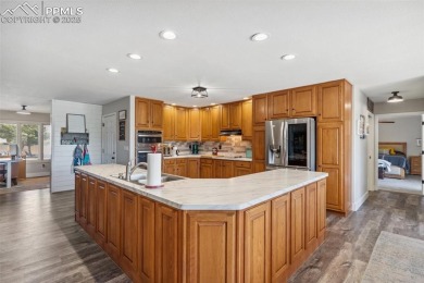 This beautifully updated rancher is a true gem--backing right up on Desert Hawk At Pueblo West in Colorado - for sale on GolfHomes.com, golf home, golf lot