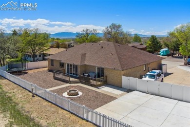 This beautifully updated rancher is a true gem--backing right up on Desert Hawk At Pueblo West in Colorado - for sale on GolfHomes.com, golf home, golf lot