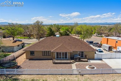 This beautifully updated rancher is a true gem--backing right up on Desert Hawk At Pueblo West in Colorado - for sale on GolfHomes.com, golf home, golf lot