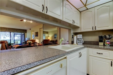 You won't want to miss this first floor 2 bedroom, 2 bath villa on Isla Del Sol Yacht and Country Club in Florida - for sale on GolfHomes.com, golf home, golf lot