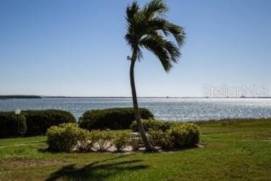 You won't want to miss this first floor 2 bedroom, 2 bath villa on Isla Del Sol Yacht and Country Club in Florida - for sale on GolfHomes.com, golf home, golf lot