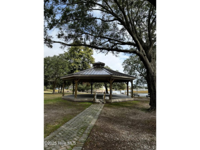 Top-Floor Investment Opportunity - Fully Furnished Condo Just on Oyster Bay Golf Links in North Carolina - for sale on GolfHomes.com, golf home, golf lot
