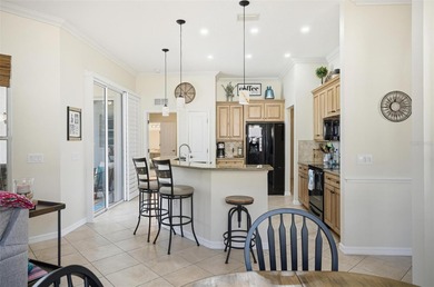 Stunning lake and golf course views from this beautifully on Grand Haven Golf Club in Florida - for sale on GolfHomes.com, golf home, golf lot