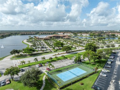 BEAUTIFUL 2 BEDROOMS 2 BATHROOMS LARGE UNIT OVERLOOKING A on Flamingo Lakes Country Club in Florida - for sale on GolfHomes.com, golf home, golf lot