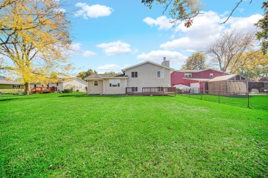 This stunning tri-level offers 4 spacious bedrooms and 2 baths on Lakes of the Four Seasons Country Club in Indiana - for sale on GolfHomes.com, golf home, golf lot