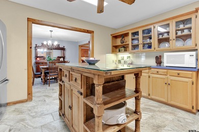 This stunning Satterwhite log home offers 2,550 square feet of on Hide-A-Way Lake Golf Course in Texas - for sale on GolfHomes.com, golf home, golf lot