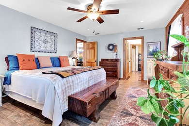 This stunning Satterwhite log home offers 2,550 square feet of on Hide-A-Way Lake Golf Course in Texas - for sale on GolfHomes.com, golf home, golf lot