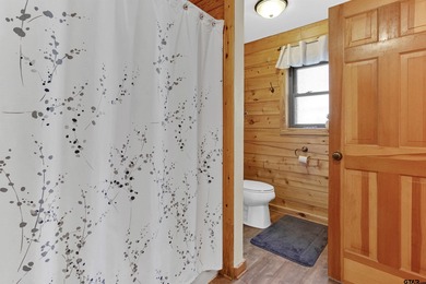 This stunning Satterwhite log home offers 2,550 square feet of on Hide-A-Way Lake Golf Course in Texas - for sale on GolfHomes.com, golf home, golf lot