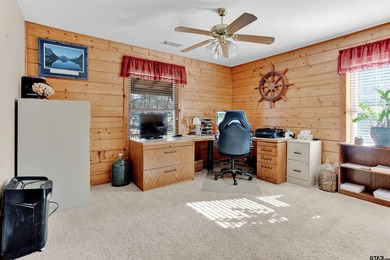 This stunning Satterwhite log home offers 2,550 square feet of on Hide-A-Way Lake Golf Course in Texas - for sale on GolfHomes.com, golf home, golf lot