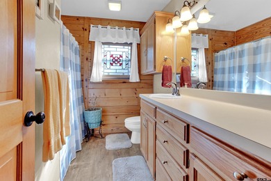 This stunning Satterwhite log home offers 2,550 square feet of on Hide-A-Way Lake Golf Course in Texas - for sale on GolfHomes.com, golf home, golf lot