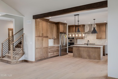 You will love this gorgeous 5-bedroom home with a spacious on Headwaters Golf Course At Granby Ranch in Colorado - for sale on GolfHomes.com, golf home, golf lot