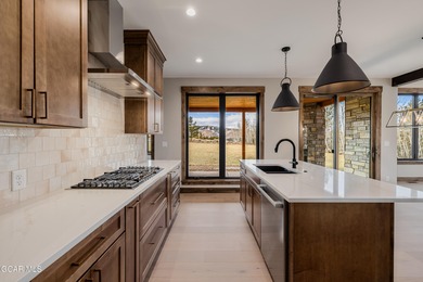 You will love this gorgeous 5-bedroom home with a spacious on Headwaters Golf Course At Granby Ranch in Colorado - for sale on GolfHomes.com, golf home, golf lot