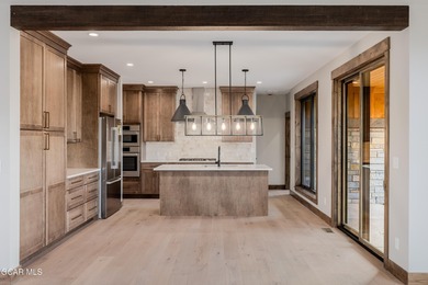 You will love this gorgeous 5-bedroom home with a spacious on Headwaters Golf Course At Granby Ranch in Colorado - for sale on GolfHomes.com, golf home, golf lot