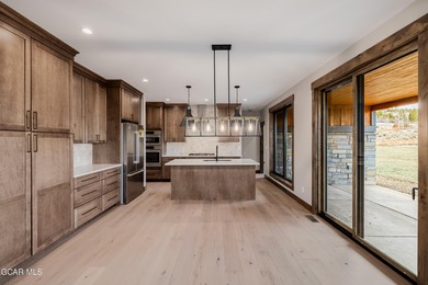 You will love this gorgeous 5-bedroom home with a spacious on Headwaters Golf Course At Granby Ranch in Colorado - for sale on GolfHomes.com, golf home, golf lot