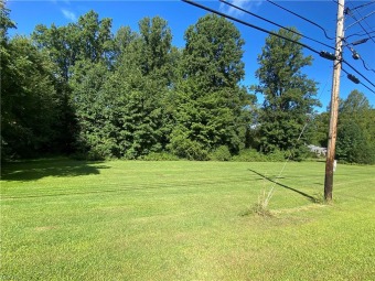 Beautiful Large Lot across from Madison Golf Course with Mature on Madison Country Club in Ohio - for sale on GolfHomes.com, golf home, golf lot