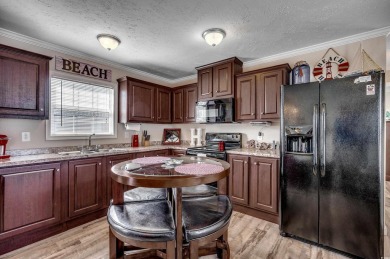 Looking for an affordable beach retreat that's move-in ready in on Barefoot Resort and Golf Club  in South Carolina - for sale on GolfHomes.com, golf home, golf lot