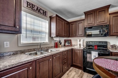 Looking for an affordable beach retreat that's move-in ready in on Barefoot Resort and Golf Club  in South Carolina - for sale on GolfHomes.com, golf home, golf lot