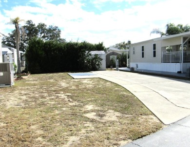 This vacant property, located in the 55+ Partridge Pines on Deer Creek RV Golf Resort in Florida - for sale on GolfHomes.com, golf home, golf lot