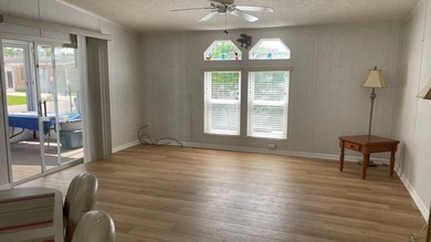 This home is located in the upscale 55+ gated community - The on Sabal Springs Golf and Racquet Club in Florida - for sale on GolfHomes.com, golf home, golf lot