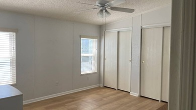 This home is located in the upscale 55+ gated community - The on Sabal Springs Golf and Racquet Club in Florida - for sale on GolfHomes.com, golf home, golf lot