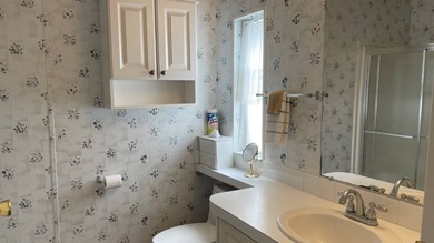 This home is located in the upscale 55+ gated community - The on Sabal Springs Golf and Racquet Club in Florida - for sale on GolfHomes.com, golf home, golf lot