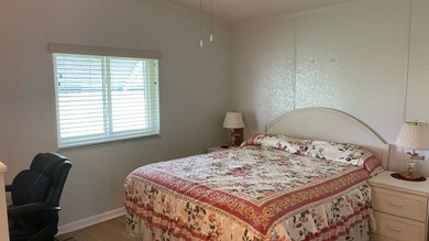 This home is located in the upscale 55+ gated community - The on Sabal Springs Golf and Racquet Club in Florida - for sale on GolfHomes.com, golf home, golf lot