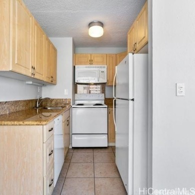 This charming condo has vinyl flooring in the unit with ceramic on Ala Wai Golf Course in Hawaii - for sale on GolfHomes.com, golf home, golf lot