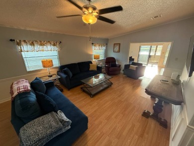 This well-cared for Palm Harbor stucco home provides beautiful on Del Tura Golf and Country Club in Florida - for sale on GolfHomes.com, golf home, golf lot