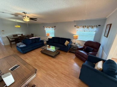 This well-cared for Palm Harbor stucco home provides beautiful on Del Tura Golf and Country Club in Florida - for sale on GolfHomes.com, golf home, golf lot