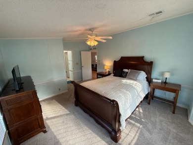 This well-cared for Palm Harbor stucco home provides beautiful on Del Tura Golf and Country Club in Florida - for sale on GolfHomes.com, golf home, golf lot