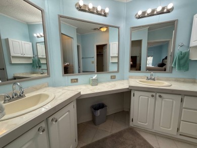 This well-cared for Palm Harbor stucco home provides beautiful on Del Tura Golf and Country Club in Florida - for sale on GolfHomes.com, golf home, golf lot