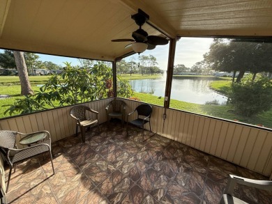 This well-cared for Palm Harbor stucco home provides beautiful on Del Tura Golf and Country Club in Florida - for sale on GolfHomes.com, golf home, golf lot