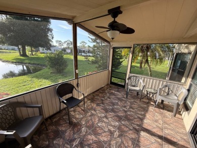 This well-cared for Palm Harbor stucco home provides beautiful on Del Tura Golf and Country Club in Florida - for sale on GolfHomes.com, golf home, golf lot