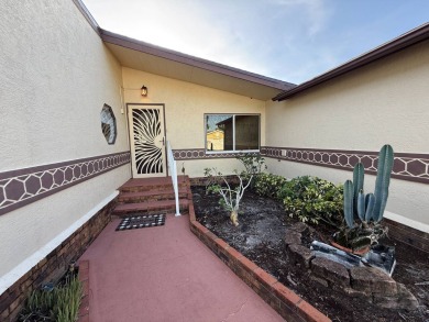 This well-cared for Palm Harbor stucco home provides beautiful on Del Tura Golf and Country Club in Florida - for sale on GolfHomes.com, golf home, golf lot