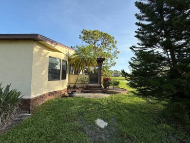 This well-cared for Palm Harbor stucco home provides beautiful on Del Tura Golf and Country Club in Florida - for sale on GolfHomes.com, golf home, golf lot