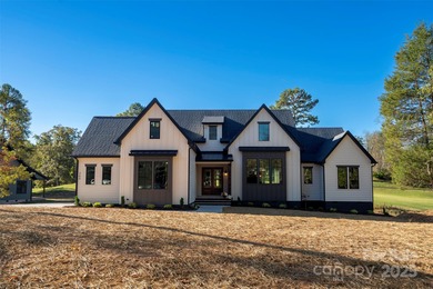 Experience refined living in this stunning new construction on River Oaks Country Club in North Carolina - for sale on GolfHomes.com, golf home, golf lot