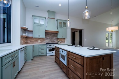 Experience refined living in this stunning new construction on River Oaks Country Club in North Carolina - for sale on GolfHomes.com, golf home, golf lot