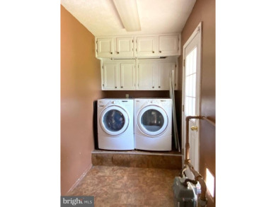 Nestled under mature shade trees in Willingboro's Country Club on Rancocas Golf Club in New Jersey - for sale on GolfHomes.com, golf home, golf lot